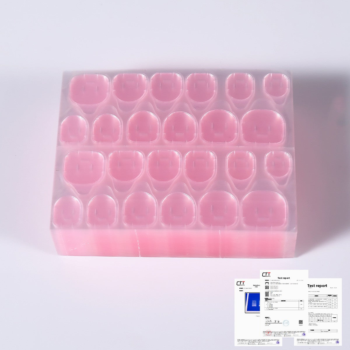 Pink press-on nail tips arranged in a clear organizer tray, rounded square ends