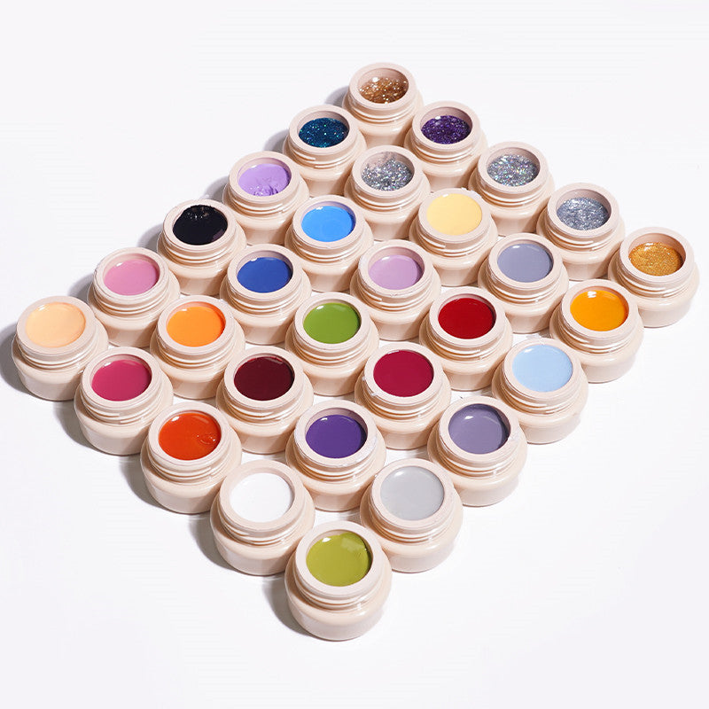 Nail polish glue color set, multiple closed jars with glitter, red, blue, pink, and green shades
