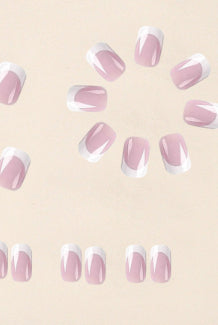 Assorted nail tips, sheer pink with white French tips and sparkly dot accents