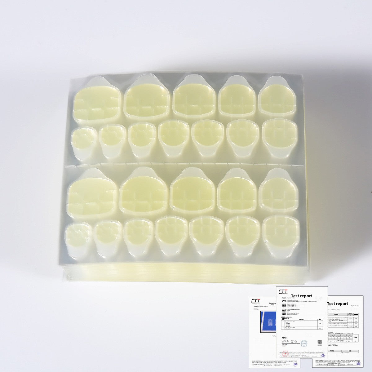 Pale yellow press-on nail tips for nail jelly glue, clear tray view