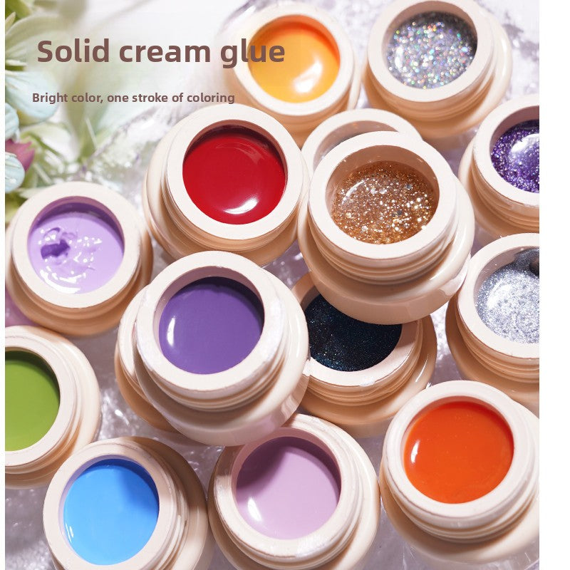 Solid cream nail glue pots with glossy colors: red, bronze glitter, purple, orange, and blue