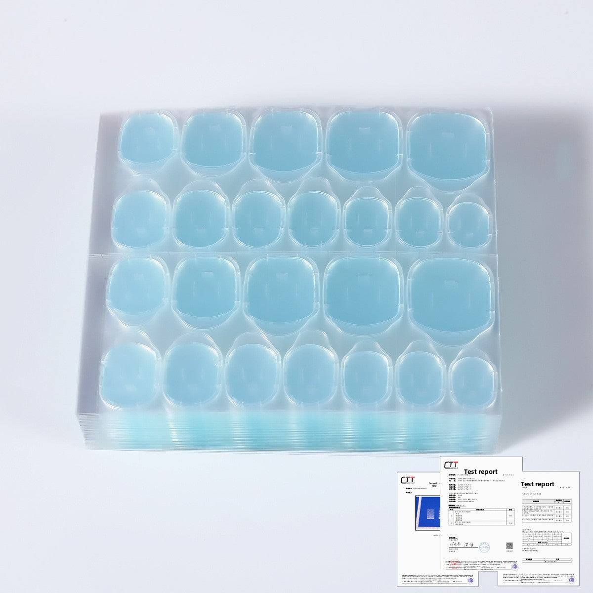 Blue nail jelly glue kit with clear tray and curved nail caps across 4 rows