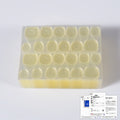 Yellow translucent press-on nail tips in divided organizer tray