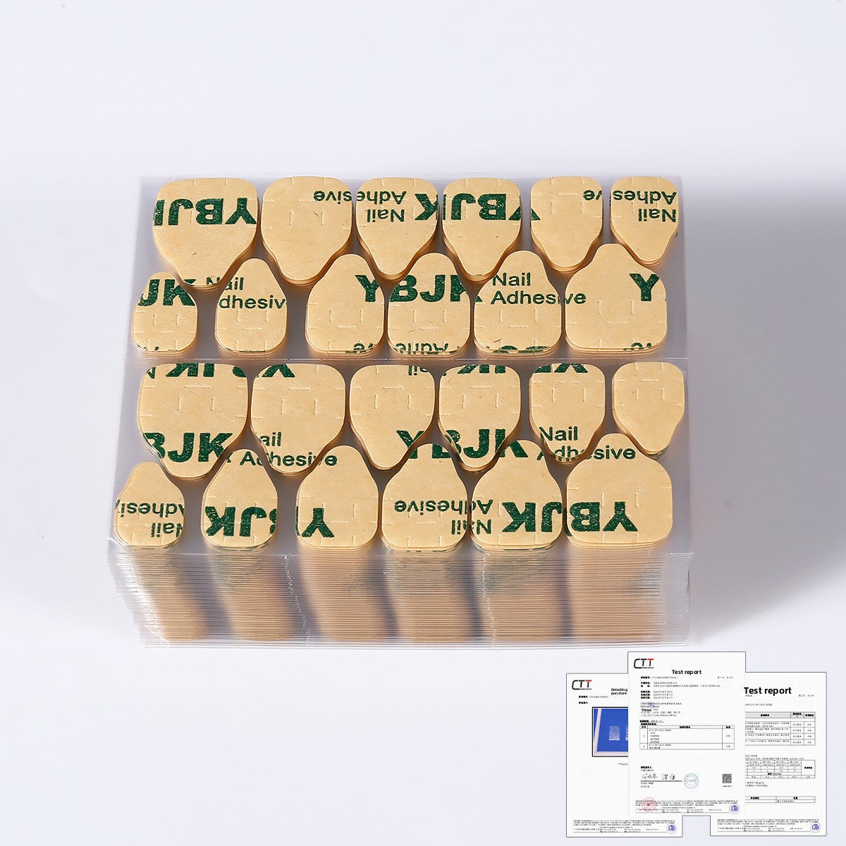 Gold-labeled nail adhesive jelly glue tips in plastic tray; includes test report card
