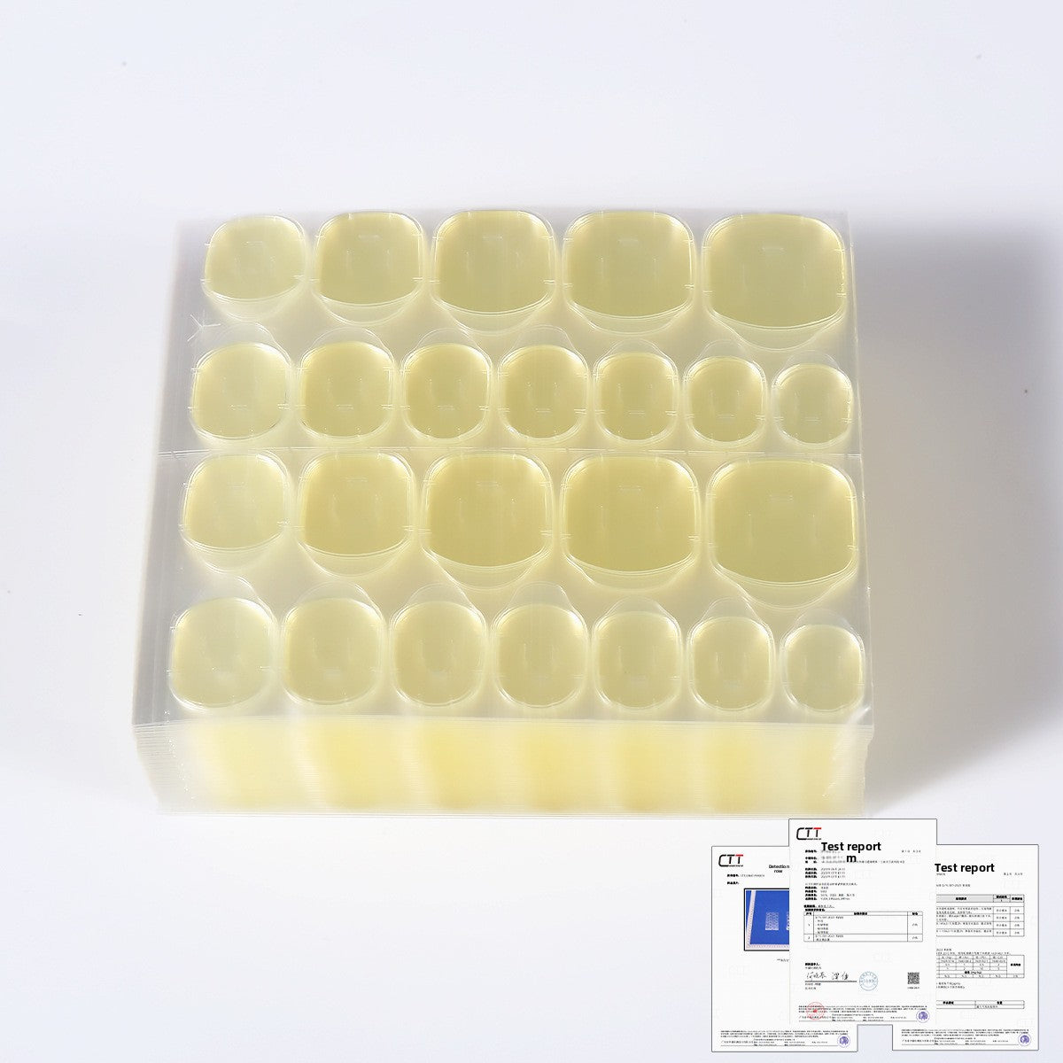 Yellow nail jelly glue gel tips set shown in clear tray with rows of rounded wells
