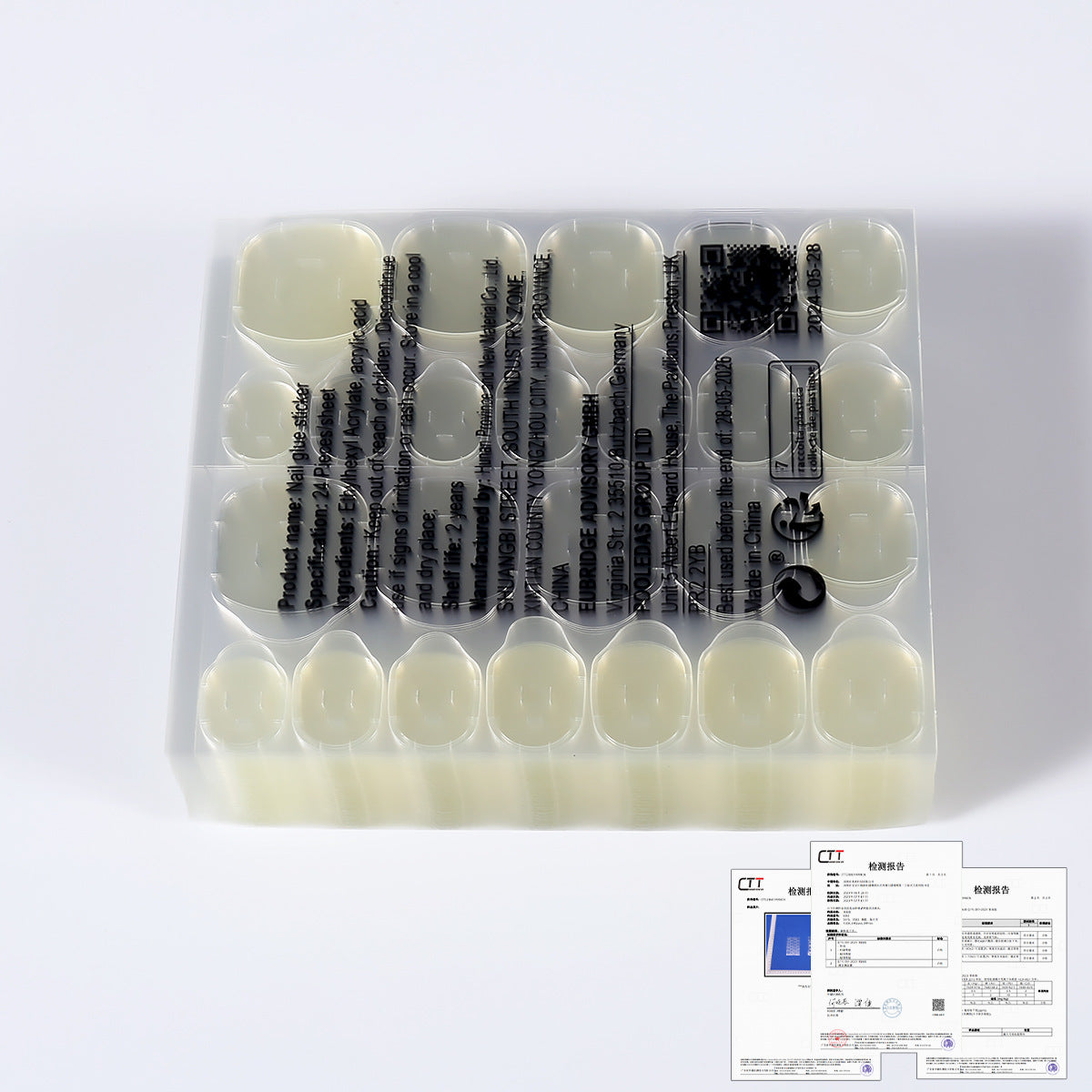 Nail jelly glue kit showing pale yellow nail tips, black tools, and instruction cards