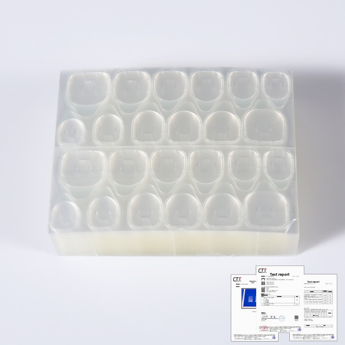 Clear nail jelly glue gel tips displayed in plastic tray with test report document